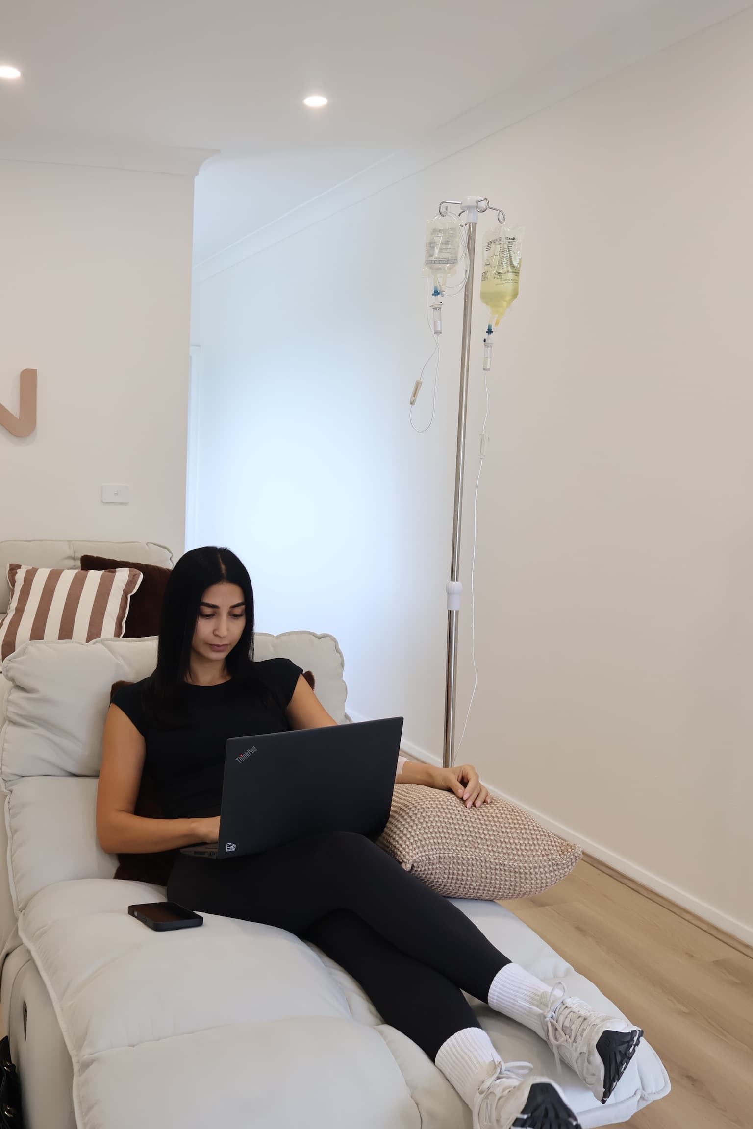 Client on laptop during IV session